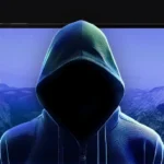 banner z laptopem i grafiką, sylwetka hakera, logo Niebezpiecznik.pl i ikona live