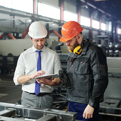 Proget mobility management for production, helmeted factory workers use tablet