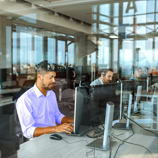 office workers at desktop computers