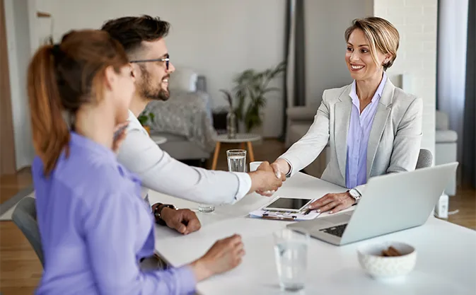 financial advisor at a meeting with clients