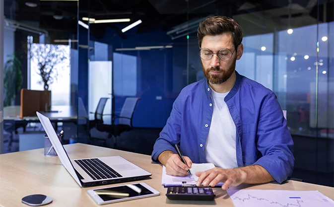 a focused finance professional and accountant doing office work